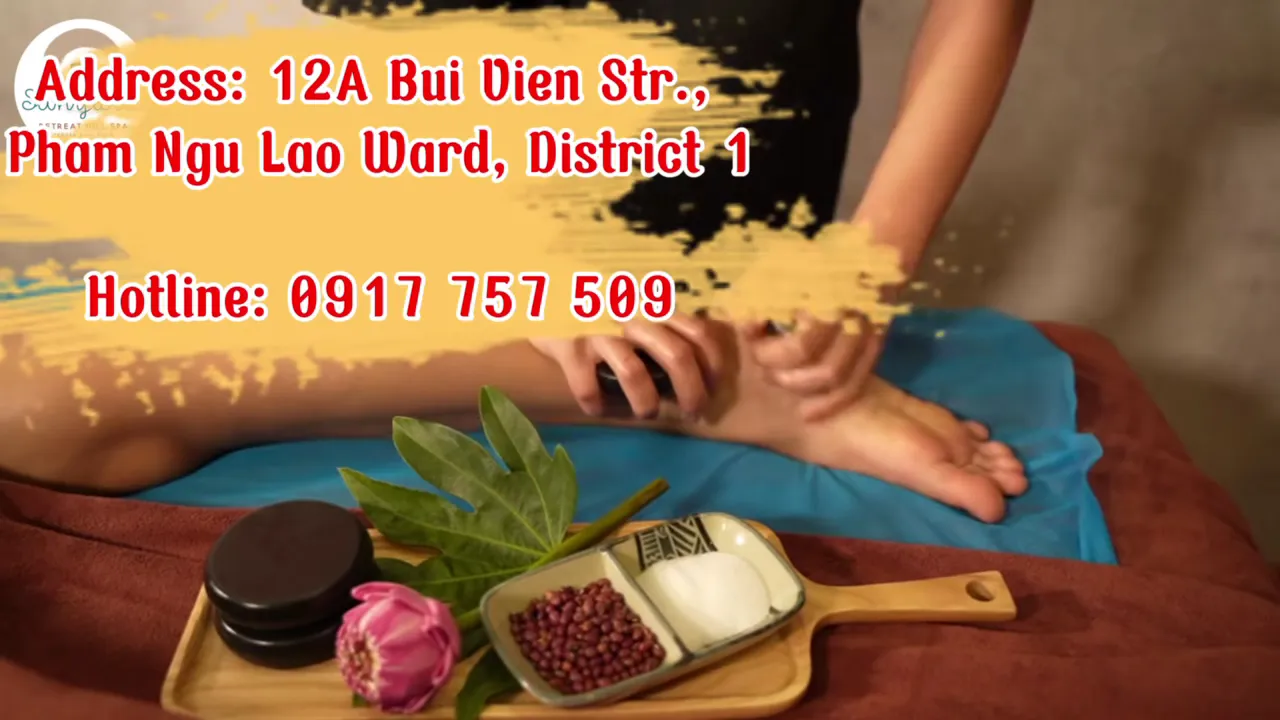 Cảnh massage chân với khay thảo dược và dụng cụ chăm sóc chân.
